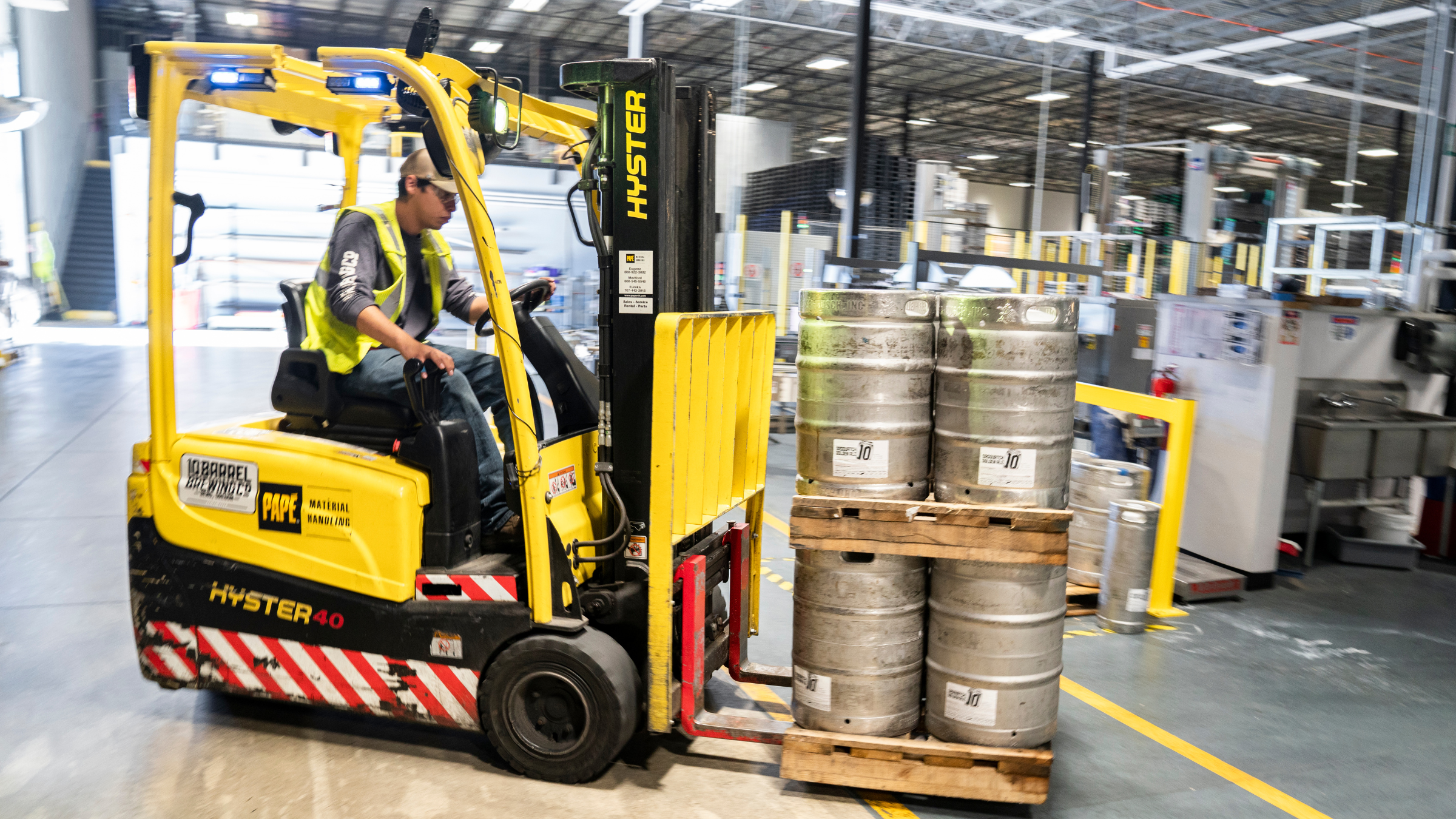 Forklift operator in warehouse
